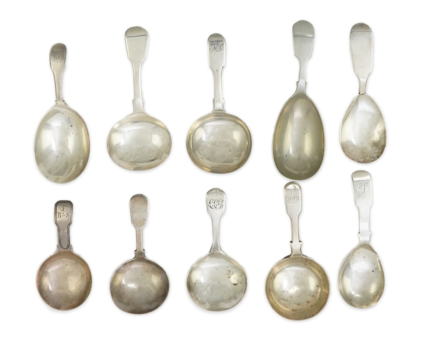 A collection of ten assorted mainly 19th century silver and white metal fiddle pattern caddy spoons